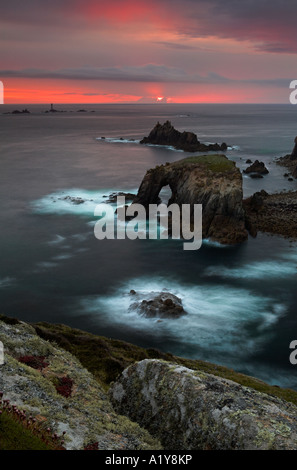 Waves crash over the rocky headland at Land s End, Cornwall, England Stock Photo