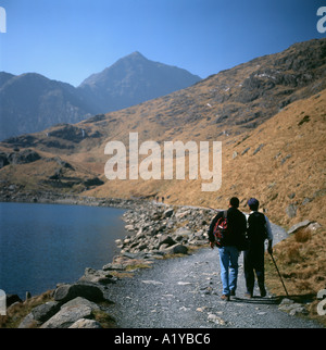 Walkers on the on a path walking towards Moel Siabod mountain in the Snowdonia National Park Gwynedd North Wales UK  KATHY DEWITT Stock Photo