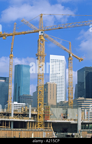 tower cranes commercial construction site Stock Photo