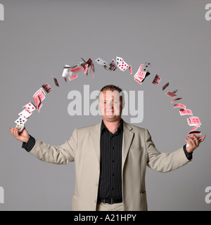 Man Juggling Playing Cards Stock Photo