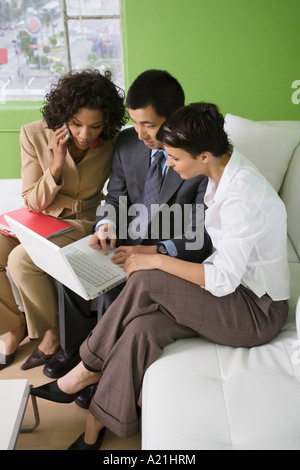 Business People Sharing Laptop Stock Photo