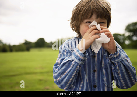 Boy Blowing Nose