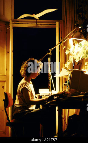 A woman using a computer at home, London Stock Photo
