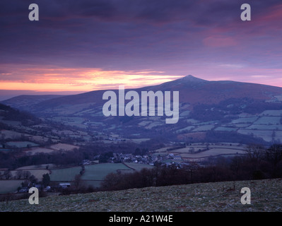 The Sugar Loaf mountain and Usk Valley at dawn from Crug Hywell in the Black Mountains of South Wales Stock Photo