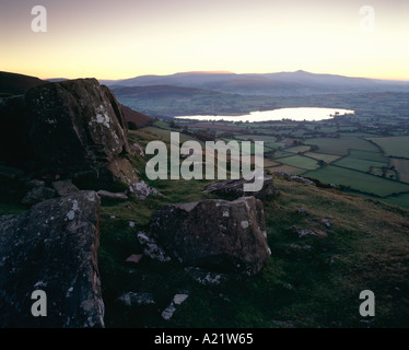 Llangorse Lake from Mynydd Llangorse and sun setting behind Pen y Fan, Brecon Beacons, Wales Stock Photo