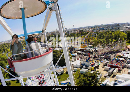 PARIS France, Family Riding in "Foie de Trone" Amusement Park on Top of Ferris Wheel, people top view, carnival rides, paris aerial view vincennes Stock Photo