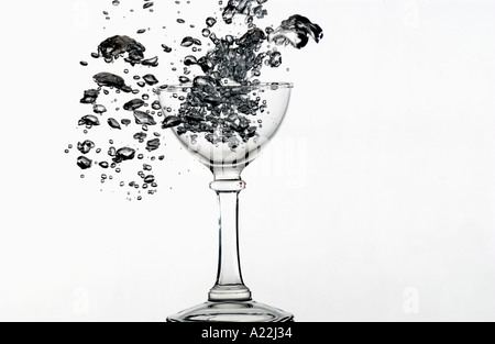 air bubbles escaping from submerged wine glass Stock Photo