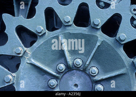 Antique military tank gears. Detail of an antiquated war machine. Heavy duty mechanical gear. Stock Photo