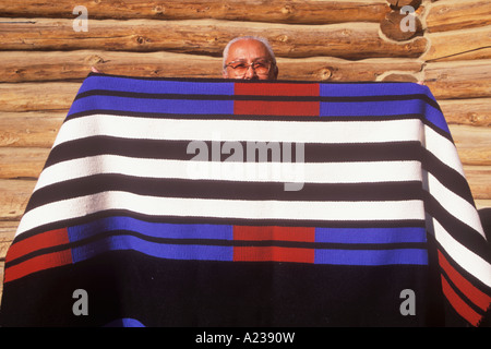 Navajo Indian weaver Sarah Natani with one of her rugs Navajo Indian Reservation Shiprock New Mexico Stock Photo