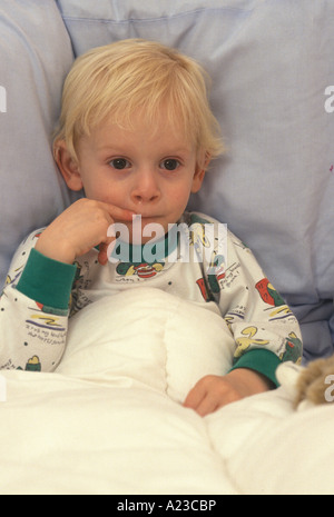 child in bed with cold
