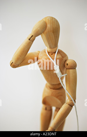 Wooden mannequin about to be hanged by the neck Stock Photo