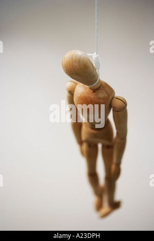 Wooden mannequin hanged by the neck Stock Photo