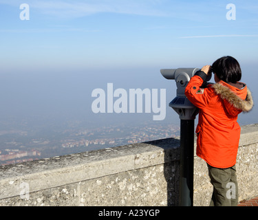 Boy with telescope, San Marino, Emilia-Romagna, Italy. Stock Photo