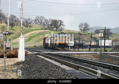 Union Pacific Freight Train approaches Grade crossing at Bealville California USA Stock Photo