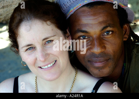 Portrait [mixed race] couple black male white female with faces together looking at you Stock Photo
