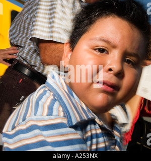 Boy with his father crossing a street in Mazatlan Mexico Stock Photo