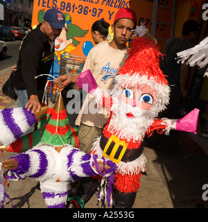 Father Christmas piñatas for sale in Mazatlan Mexico. Stock Photo
