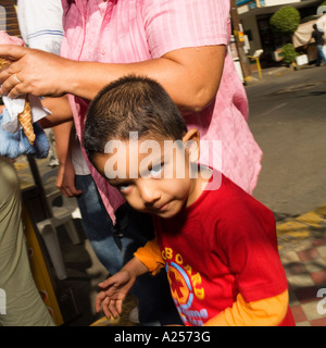 Boy with his mother on the streets of downtown Mazatlan Mexico Stock Photo
