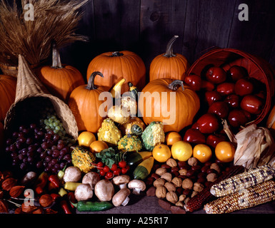 Harvest still life with a profusion of Autumnal fruit vegetables gourds and farm produce Stock Photo