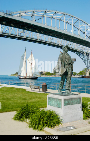 The Tall Ship Highlander sails under the Blue Water International Bridge at Port Huron Michigan MI Stock Photo