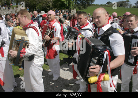 Musicians following the Padstow Obby Oss outside Prideaux Place during the traditional May Day celebrations Stock Photo