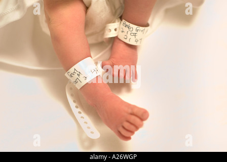 Detail of a newborn baby s feet with identification tag Postnatal labour ward Stock Photo