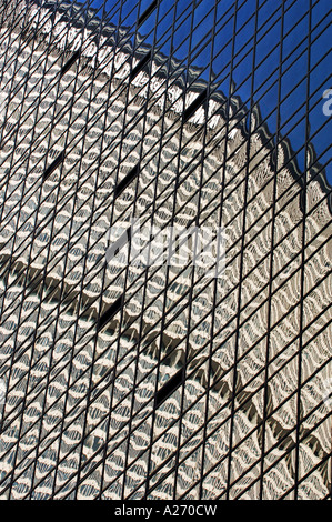 Skyscrapers reflected in glass tower of the flagship Hyatt Hotel by Grand Central Station on 42nd Street Manhattan Stock Photo