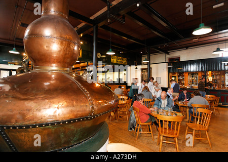 An old pot still (a giant copper kettle) used for the distillation in the Bushmills Whiskey Distillery, Bushmills, Londonderry Stock Photo