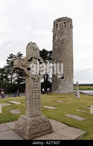 The southcross a celtic cross (copy) and roundtower in the area of the abbey of Clonmacnoise, Offaly, Ireland Stock Photo