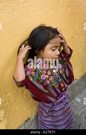 GUATEMALA ANTIGUA Young Cakchiquel girl in beautifully embroidered traditional huipil and corte Stock Photo