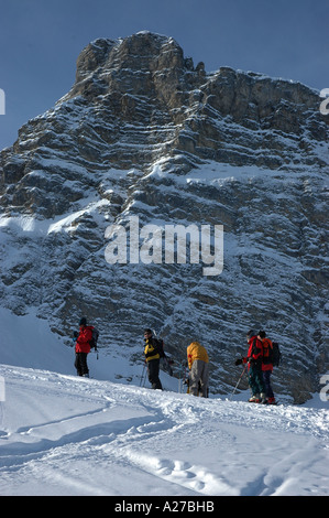 ski and snowboard mountaineers ascending Rauflihorn in winter Diemtigtal Diemtig valley Bernese Alps Switzerland Stock Photo