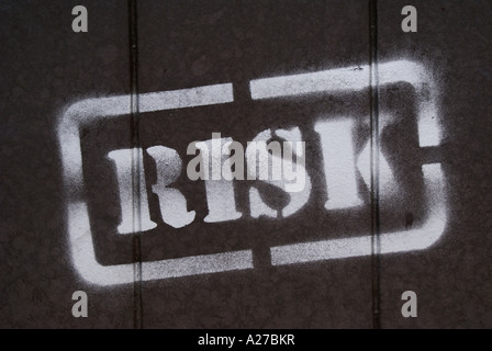 Stamp "Risk" on a metal gate Stock Photo