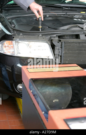 Adjustment of head lights in a garage Stock Photo