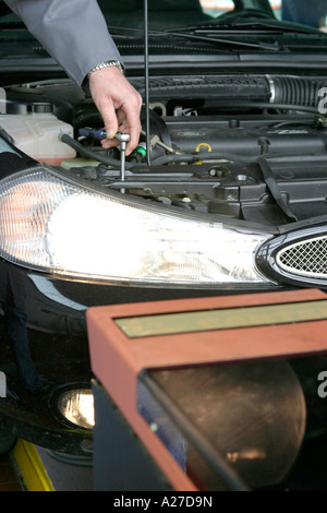 Adjustment of head lights in a garage Stock Photo