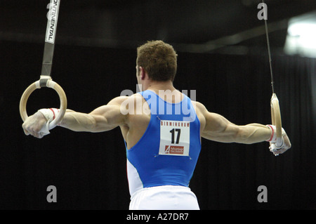 Italian male Gymnast Matteo Morandi on the rings holding the crucifix position Stock Photo