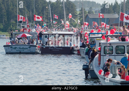 Boats prepare for procession of fishing fleet on Canada Day Rustico Prince Edward Island Stock Photo