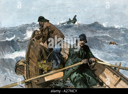 Fishermen in a dory on the Grand Banks off Newfoundland 1880s. Hand-colored woodcut Stock Photo