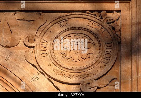 Cipher of Queen Victoria carved into the flank of an arch at Buckingham Palace, London, England Stock Photo