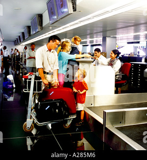 Dubai Airport UAE Sheikh Rashid Terminal Family At Check In Desk Stock Photo