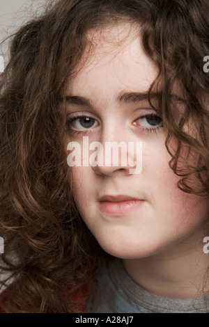 PORTRAIT OF 11 YEAR OLD BOY WITH LONG CURLY HAIR Stock Photo