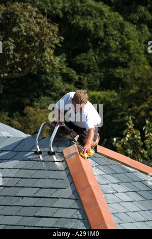 a builder fixing roof Stock Photo