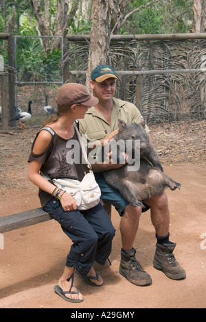 Tourist and zoo keeper with a Common Wombat Vombatus ursinus Stock Photo