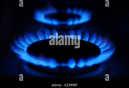 two gas burners on a gas hob in a kitchen Stock Photo