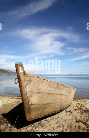 Rowing boat beached on shore. Lake Ohrid, Pogradeci, Albania, Europe Stock Photo