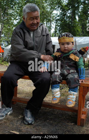 Native cree Baby in traditional costume next to James bay Quebec canada ...