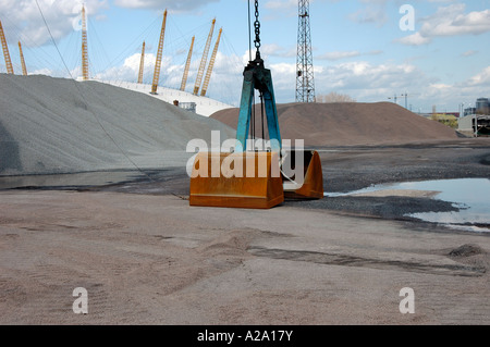 Scoop of crane in builders yard, O2 Millennium Dome visable in the back ground. Stock Photo