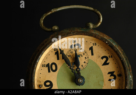 old alarm clock, clock face, five minutes before twelve Stock Photo