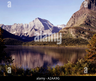 Mount Gould reflected in Swiftcurrent Lake in Glacier National Park in Montana Stock Photo