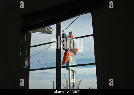 View of the 'Roy's Cafe' sign on Route 66 Amboy, California, USA, as seen through motel room window. Stock Photo