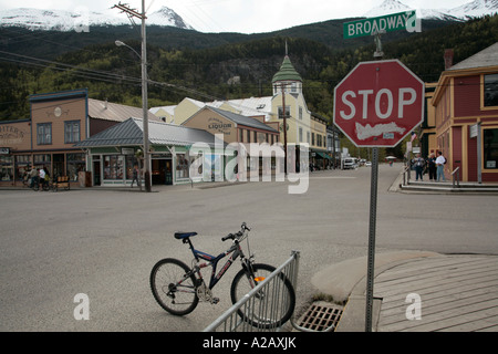 Crossroad stop sign and bicycle, Skagway, alaska Stock Photo